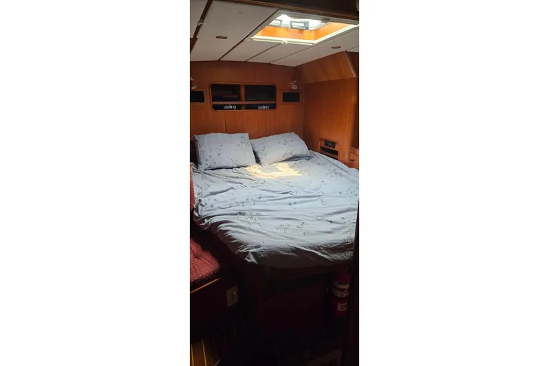 Slide: The Image of Cozy cabin interior of a 1996 Contest 46/48 yacht with a skylight and double bed. - 8