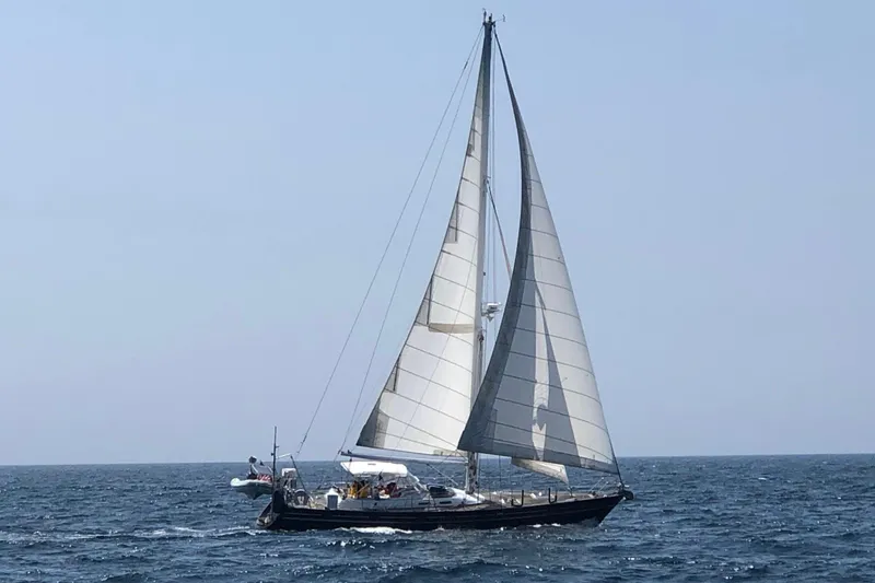 Slide: The Image of Sailing yacht Contest 46/48 from 1996 on open sea with full sails. - 1