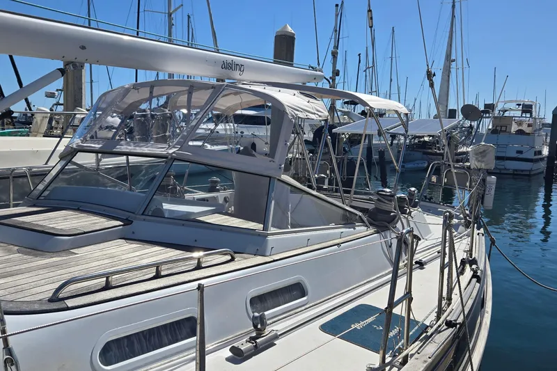 Slide: The Image of Sailboat docked in marina, Contest 46/48 model, 1996, with clear skies. - 16
