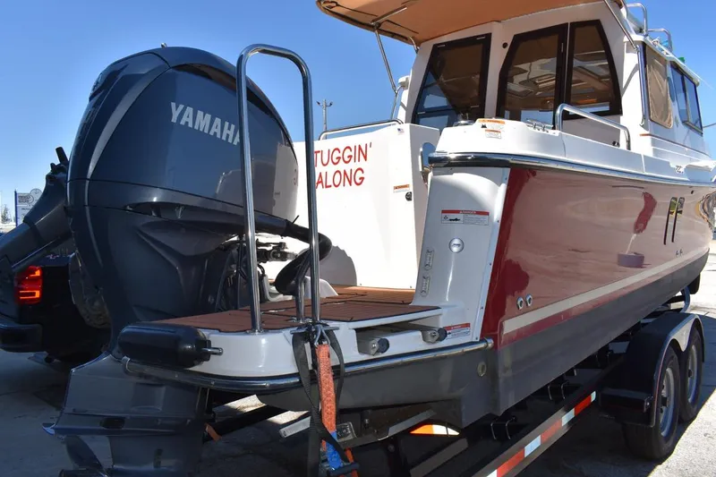 Slide: The Image of 2024 Ranger Tugs R-25 boat with Yamaha engine on trailer. - 27