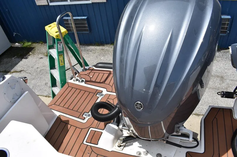 Slide: The Image of 2024 Ranger Tugs R-25 boat with Yamaha outboard motor and teak deck. - 9