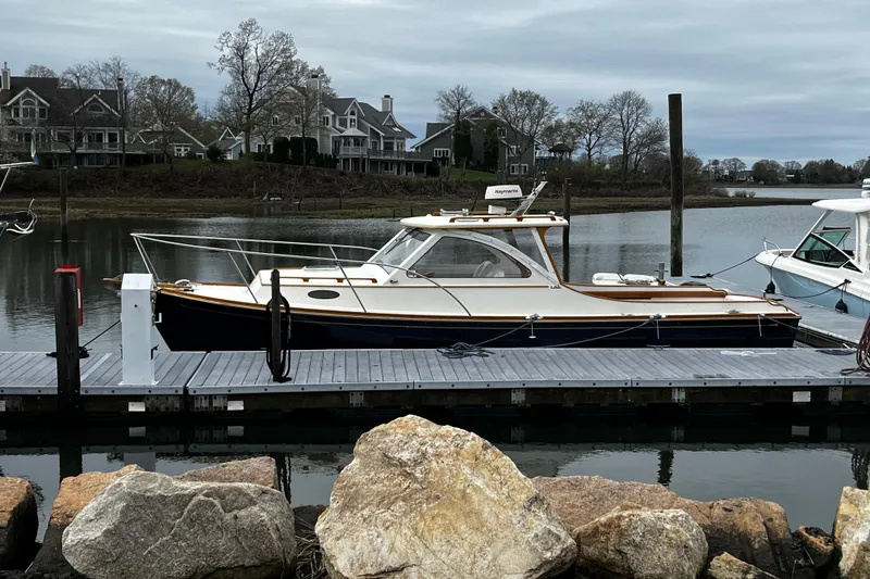 The Image of 2003 Lyman-Morse Monhegan 30 yacht docked by waterfront homes. - 0