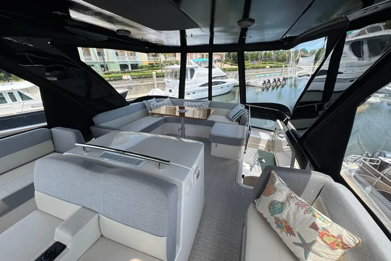 Slide: The Image of Luxurious interior of 2017 Tiara Yachts F53 Flybridge with marina view. - 13