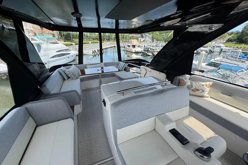 Slide: The Image of Luxurious interior of 2017 Tiara Yachts F53 Flybridge with marina view. - 14