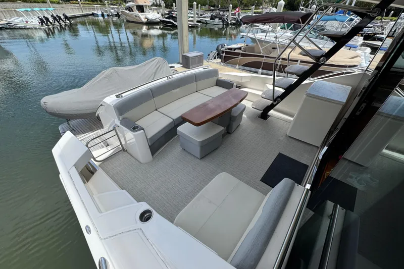 Slide: The Image of Luxurious 2017 Tiara Yachts F53 Flybridge with spacious seating and elegant design at marina. - 19