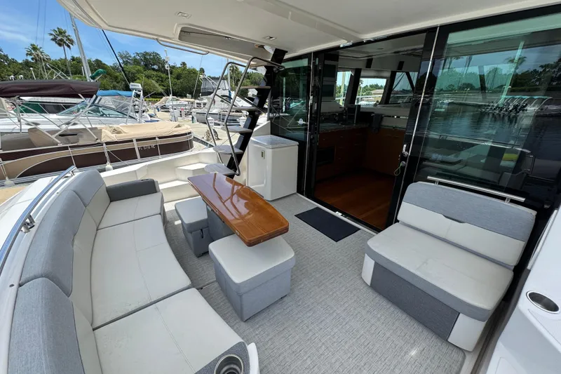 Slide: The Image of Luxurious 2017 Tiara Yachts F53 Flybridge with spacious outdoor seating and elegant interior. - 22