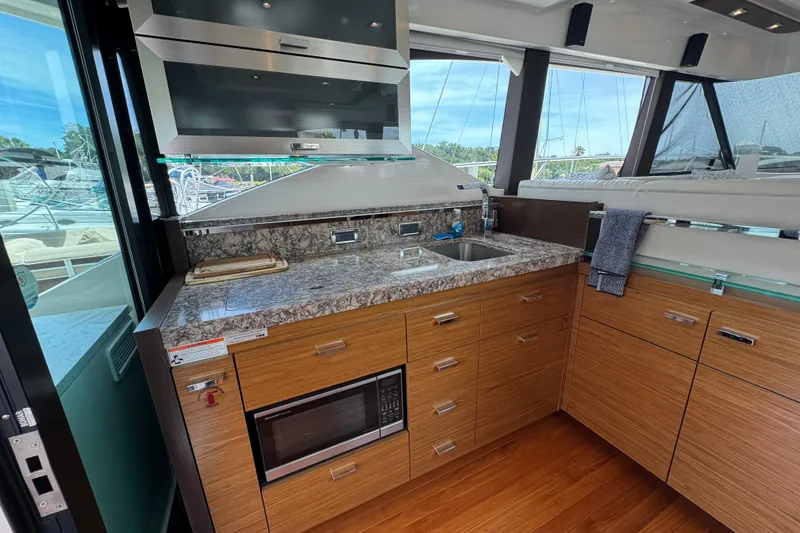 Slide: The Image of Luxurious kitchen interior of 2017 Tiara Yachts F53 Flybridge with modern amenities. - 29