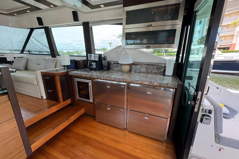 Slide: The Image of Luxurious interior of 2017 Tiara Yachts F53 Flybridge with modern kitchen amenities. - 30