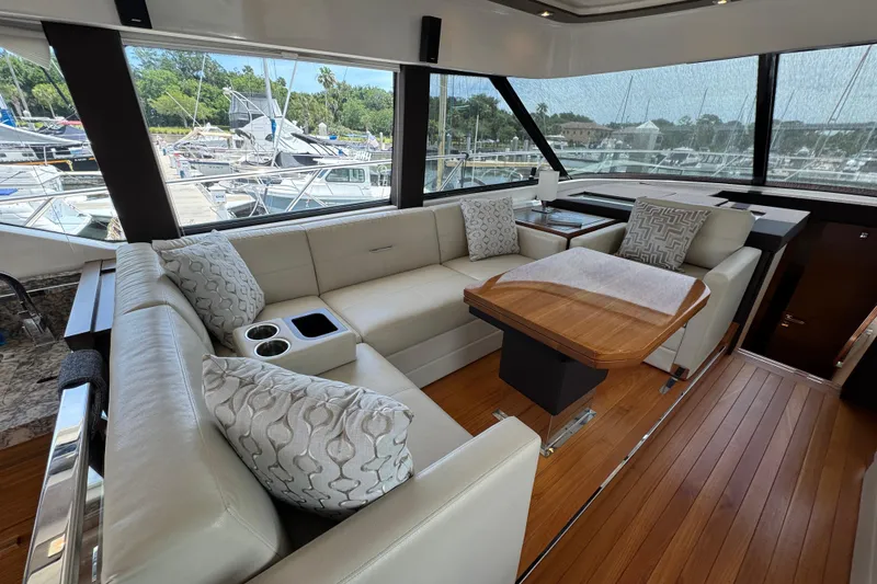 Slide: The Image of Luxurious interior of 2017 Tiara Yachts F53 Flybridge with elegant seating and wooden table. - 33