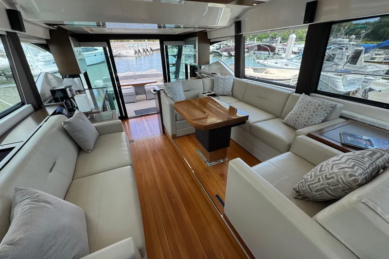 Slide: The Image of Luxurious interior of 2017 Tiara Yachts F53 Flybridge with elegant seating and wooden flooring. - 36
