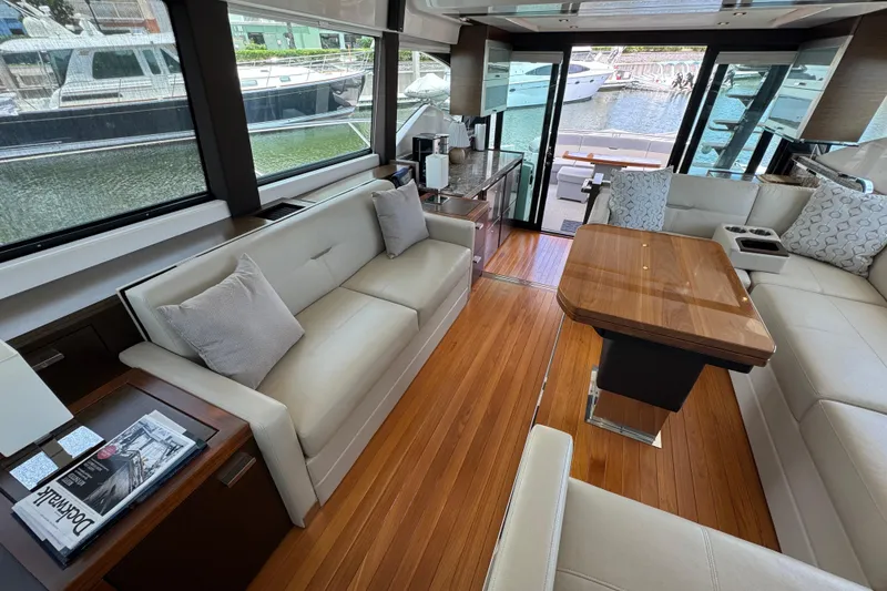 Slide: The Image of Luxurious interior of 2017 Tiara Yachts F53 Flybridge with elegant seating and wooden flooring. - 37