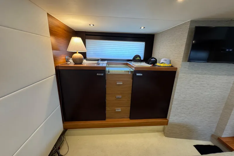 Slide: The Image of Interior of 2017 Tiara Yachts F53 Flybridge with modern cabinetry and ambient lighting. - 48