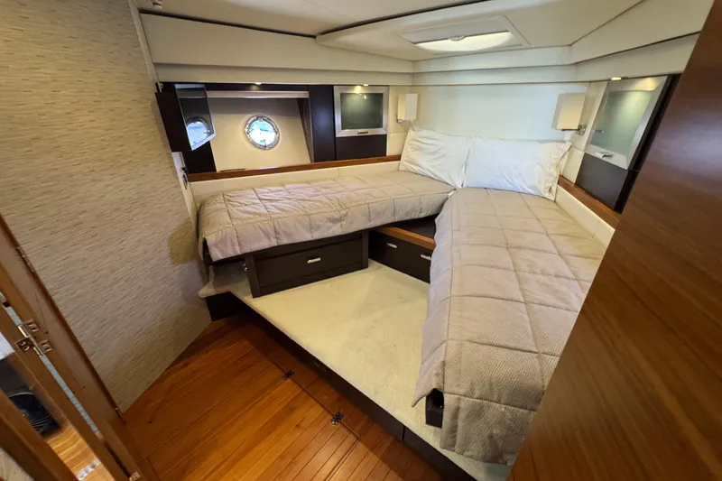 Slide: The Image of Luxurious cabin interior of 2017 Tiara Yachts F53 Flybridge with twin beds. - 54