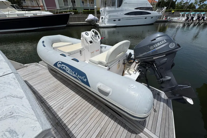 Slide: The Image of Inflatable Capelli 340 LE boat with Yamaha motor docked near Tiara Yachts F53 Flybridge. - 58