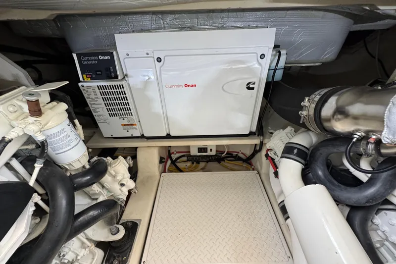 Slide: The Image of Engine room of 2017 Tiara Yachts F53 Flybridge with Cummins Onan generator. - 62