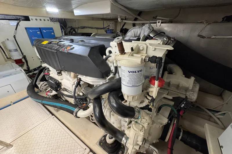 Slide: The Image of Engine room of 2017 Tiara Yachts F53 Flybridge, featuring Volvo components and detailed mechanical setup. - 63