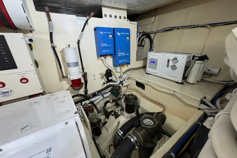 Slide: The Image of Engine room of 2017 Tiara Yachts F53 Flybridge with electrical and mechanical components. - 66