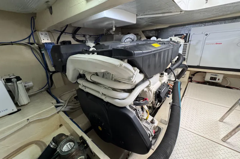 Slide: The Image of Engine room of 2017 Tiara Yachts F53 Flybridge with Cummins Onan generator. - 72