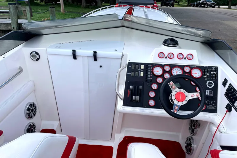 Slide: The Image of Cockpit of a 1995 Fountain 42 Lightning boat with gauges and steering wheel. - 11