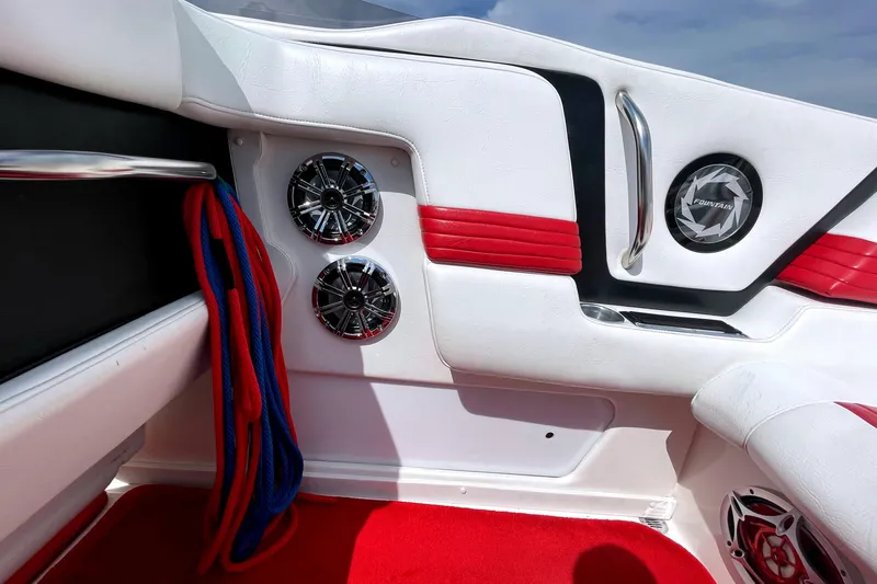 Slide: The Image of Interior of a 1995 Fountain 42 Lightning boat with red and white accents. - 12
