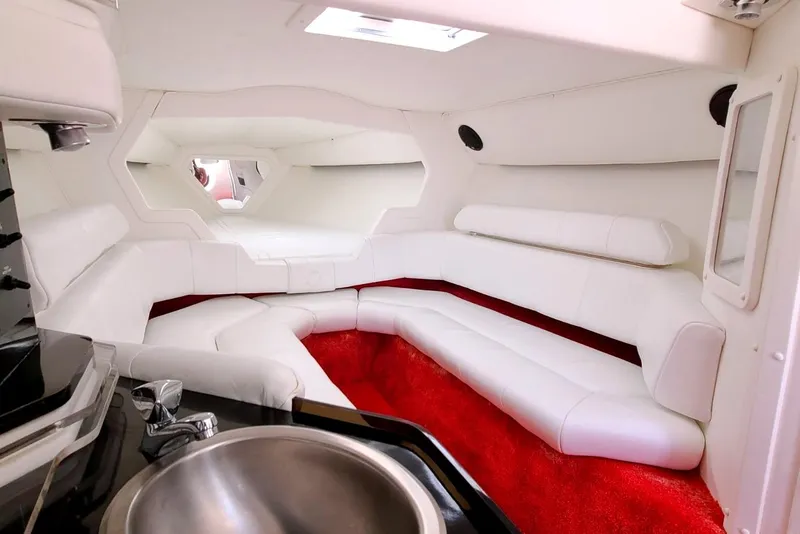 Slide: The Image of Luxurious white interior of 1995 Fountain 42 Lightning boat with red carpet accents. - 15