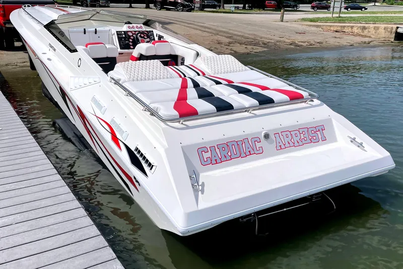 Slide: The Image of 1995 Fountain 42 Lightning speedboat docked, featuring bold red and black graphics. - 6