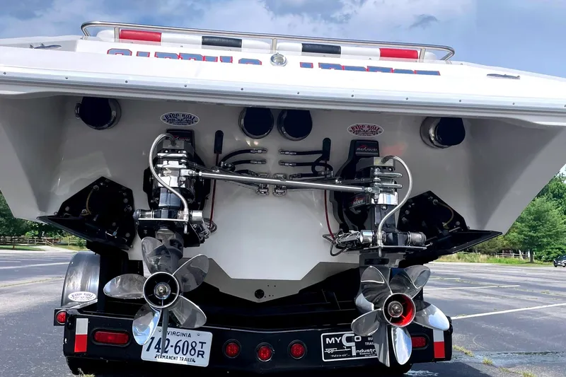 Slide: The Image of Rear view of a 1995 Fountain 42 Lightning boat with dual propellers. - 8