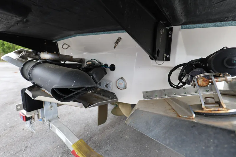Slide: The Image of Rear view of a 2023 MasterCraft X24 boat's propulsion system and trailer. - 11