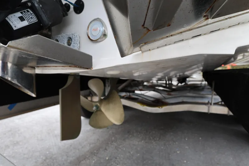 Slide: The Image of 2023 MasterCraft X24 boat propeller and underside detail. - 12