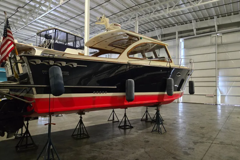 The Image of 2009 Vicem Windsor Craft 36 Hardtop yacht in a spacious indoor storage facility. - 0