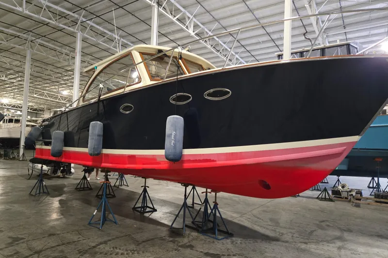 Slide: The Image of 2009 Vicem Windsor Craft 36 Hardtop boat in a warehouse on stands. - 1