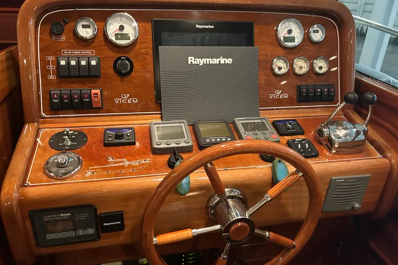 Slide: The Image of Control panel of 2009 Vicem Windsor Craft 36 Hardtop with Raymarine navigation system. - 10