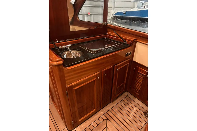 Slide: The Image of Luxurious wooden interior of 2009 Vicem Windsor Craft 36 Hardtop yacht kitchen area. - 12