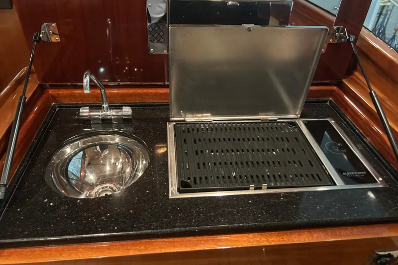 Slide: The Image of Luxurious 2009 Vicem Windsor Craft 36 Hardtop yacht kitchen with sink and grill. - 13