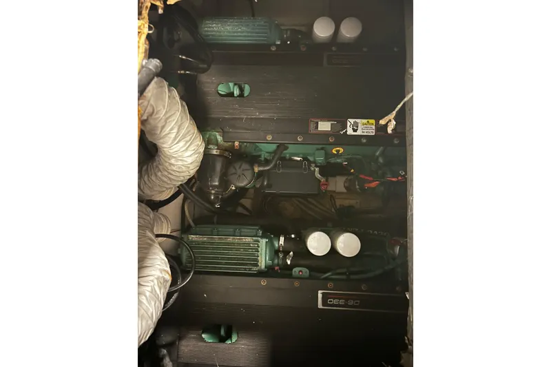 Slide: The Image of Engine compartment of a 2009 Vicem Windsor Craft 36 Hardtop, showcasing mechanical components. - 14