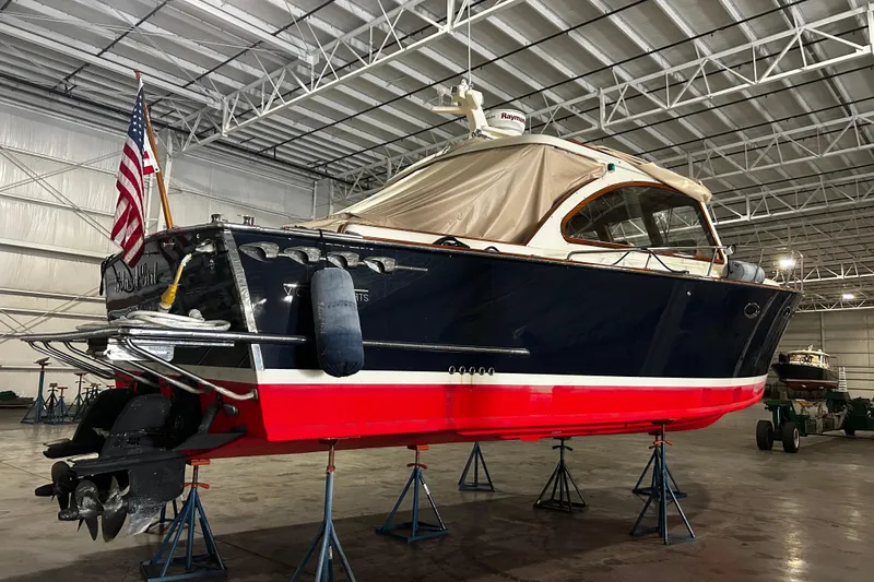 Slide: The Image of 2009 Vicem Windsor Craft 36 Hardtop boat in a warehouse, elevated on stands. - 3