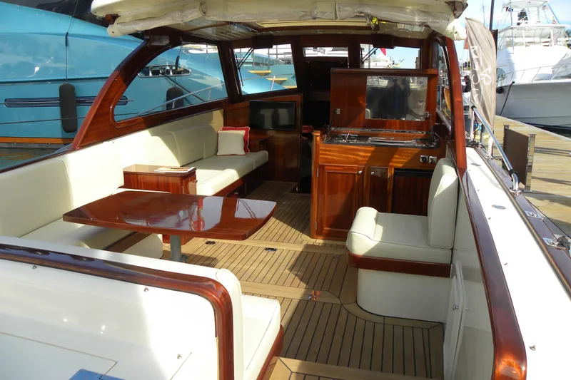 Slide: The Image of 2009 Vicem Windsor Craft 36 Hardtop interior with elegant wood finish and seating area. - 6