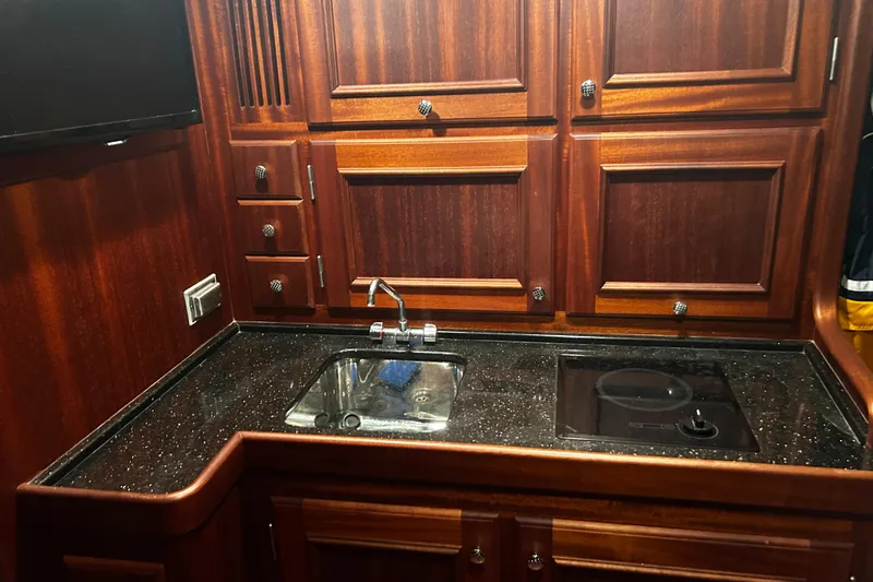 Slide: The Image of Luxurious wooden kitchen interior of 2009 Vicem Windsor Craft 36 Hardtop yacht. - 8