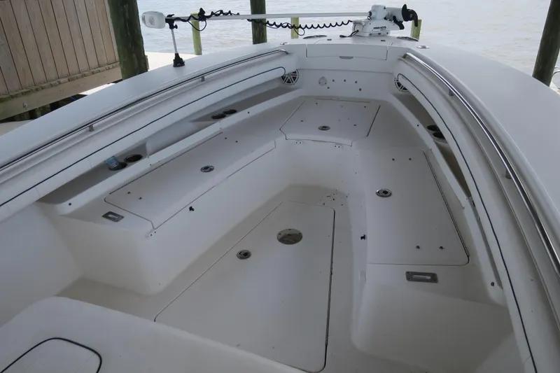 Slide: The Image of 2016 Regulator 28 boat interior with spacious seating and storage compartments. - 4
