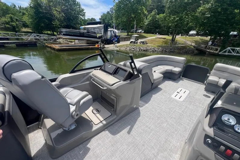 Slide: The Image of 2017 Premier 270 Super Sport boat interior with seating and control panel on a sunny day. - 10
