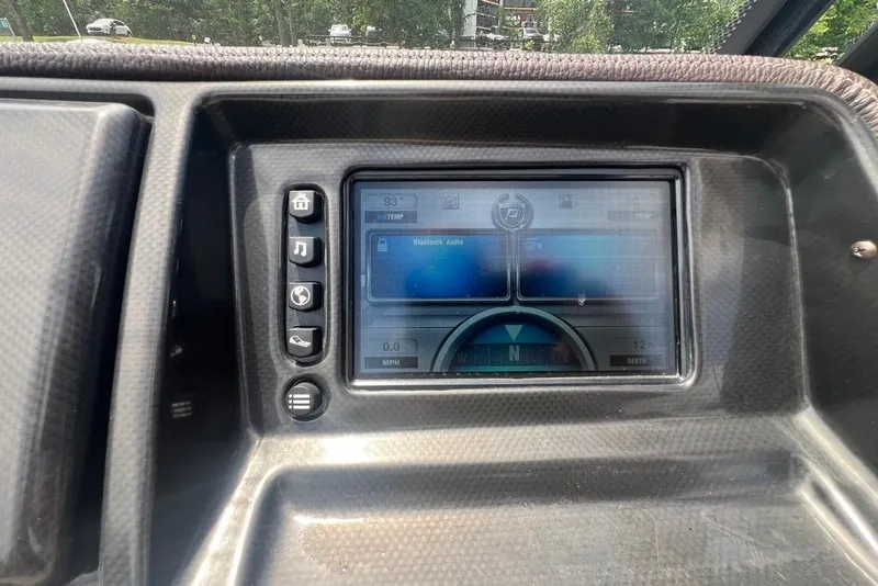 Slide: The Image of Dashboard of a 2017 Premier 270 Super Sport boat with touchscreen controls. - 11