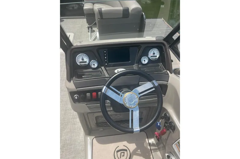 Slide: The Image of Steering console of a 2017 Premier 270 Super Sport boat with gauges and controls. - 15