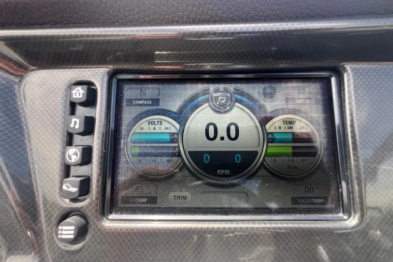 Slide: The Image of Dashboard display of a 2017 Premier 270 Super Sport boat showing volts, temperature, and RPM. - 17
