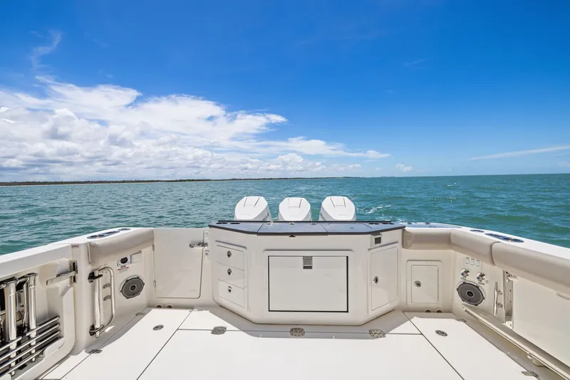 Slide: The Image of Boston Whaler 365 Conquest 2025 on open sea under clear sky. - 42