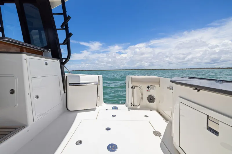 Slide: The Image of Boston Whaler 365 Conquest 2025, spacious deck with ocean view. - 47