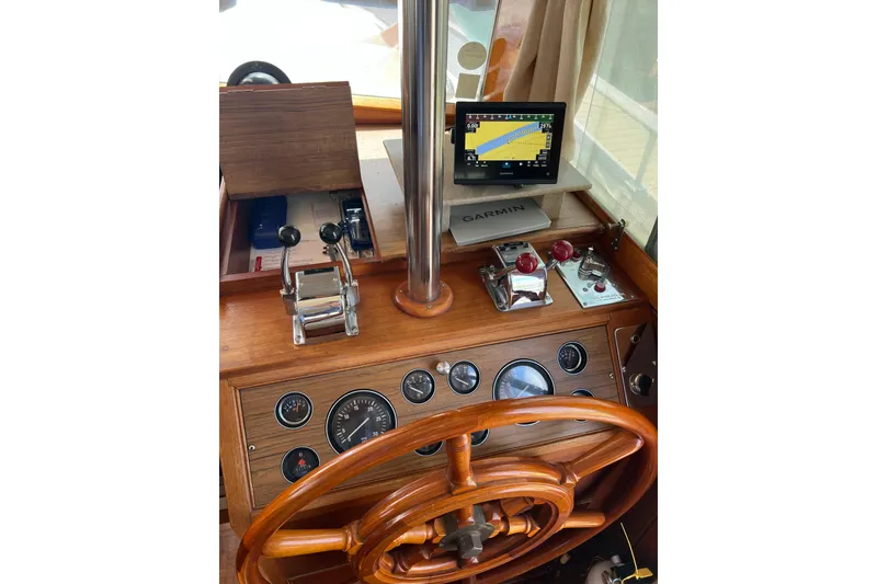 Slide: The Image of Helm of 1991 Grand Banks 42 Motoryacht with wooden wheel and Garmin navigation system. - 10