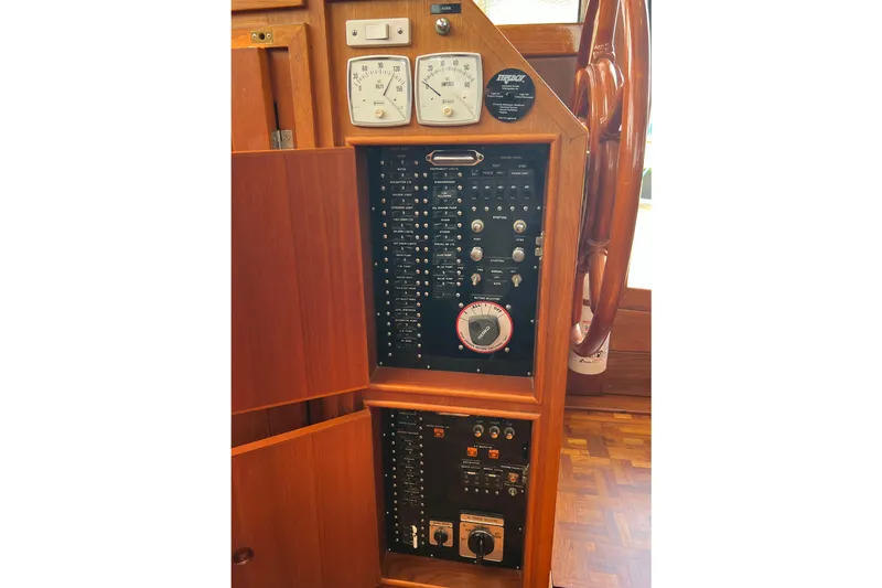 Slide: The Image of Control panel of a 1991 Grand Banks 42 Motoryacht with gauges and switches. - 13