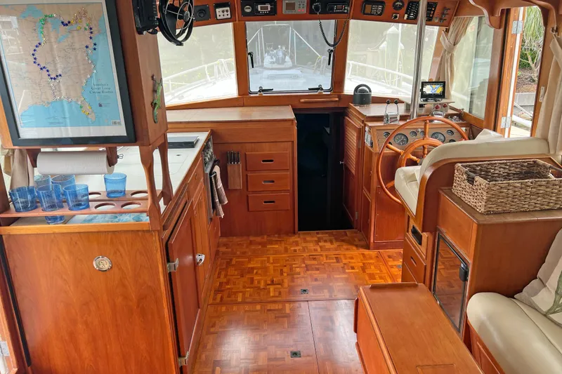 Slide: The Image of Interior of 1991 Grand Banks 42 Motoryacht with wooden cabinetry and navigation area. - 3