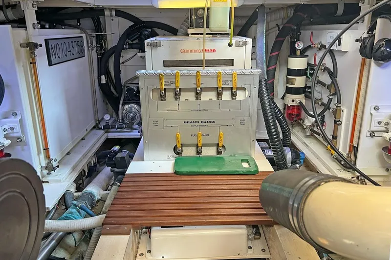 Slide: The Image of Engine room of a 1991 Grand Banks 42 Motoryacht with Cummins components and control panel. - 30
