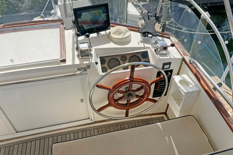Slide: The Image of Helm of 1991 Grand Banks 42 Motoryacht with wooden wheel and navigation equipment. - 36
